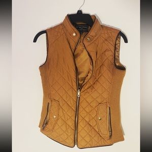 Small fitted vest, all zippers are functioning.